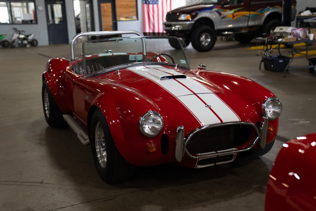 Restomod Shelby Cobra in a service garage